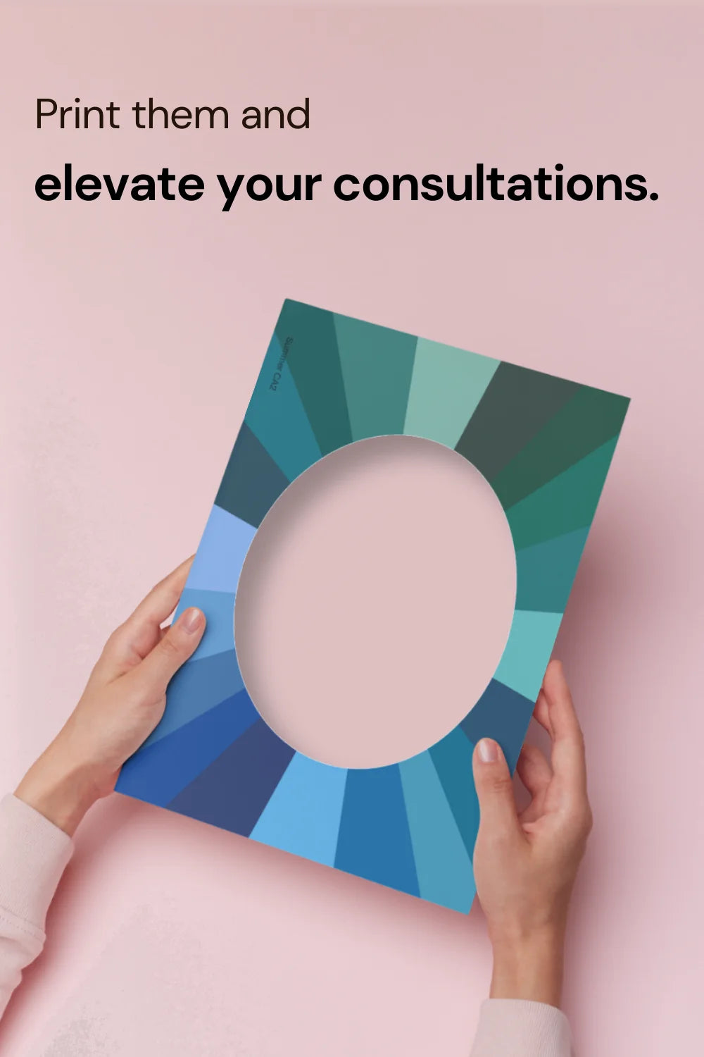 Hands holding a printed face frame from the Color Analysis Printable Face Frames Kit, with text stating 'print them and elevate your consultations'.