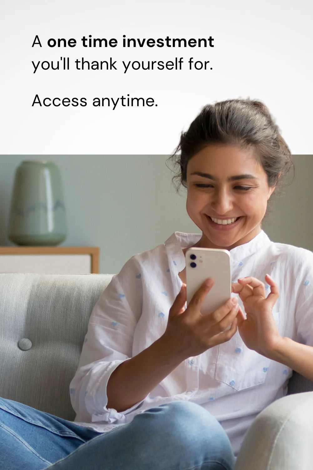 Woman reading guide on phone at home, emphasizing one-time investment and anytime access.